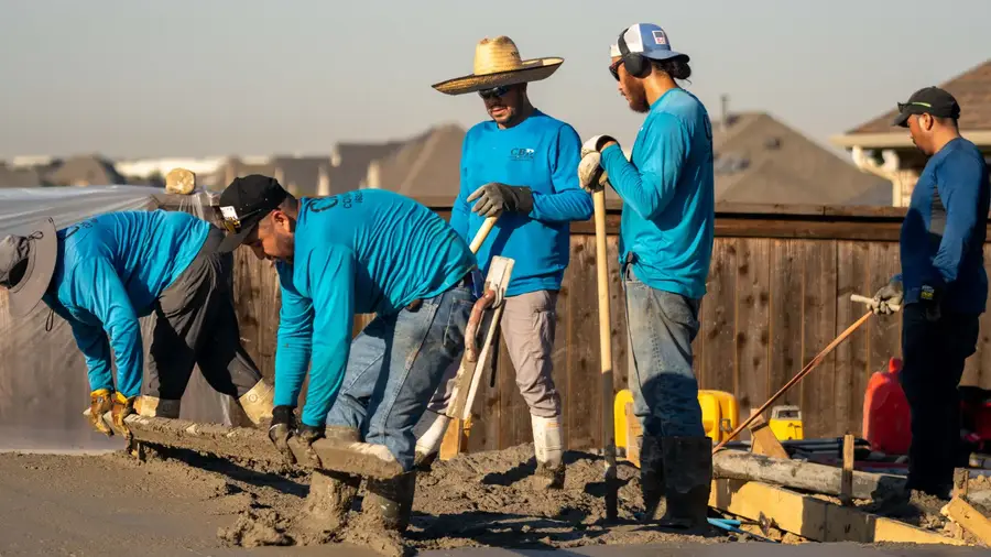 CBD Concrete's crew screeding a fresh slab.